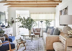 A clean and organized living room filled with natural light.