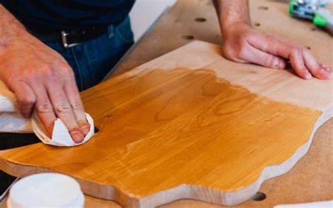 Before and after comparison of a wood cutting board, demonstrating the effectiveness of proper cleaning and maintenance.