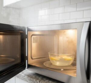 Steam cleaning microwave with lemon water bowl
