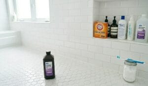 Shiny clean bathroom tiles and regrouted shower floor after cleaning
